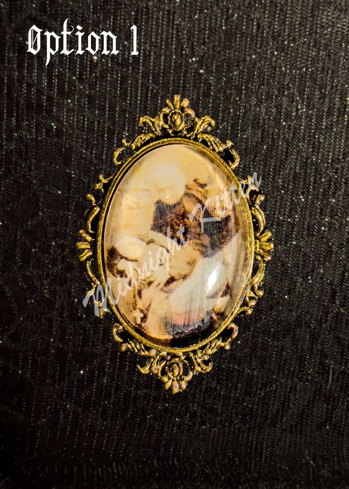 A gold ring with the decorative setting of a framed photograph on a hand against a textured black background. Option 1 contains a piece of Victorian-era pornography depicting a priest having intimate relations with a nun.